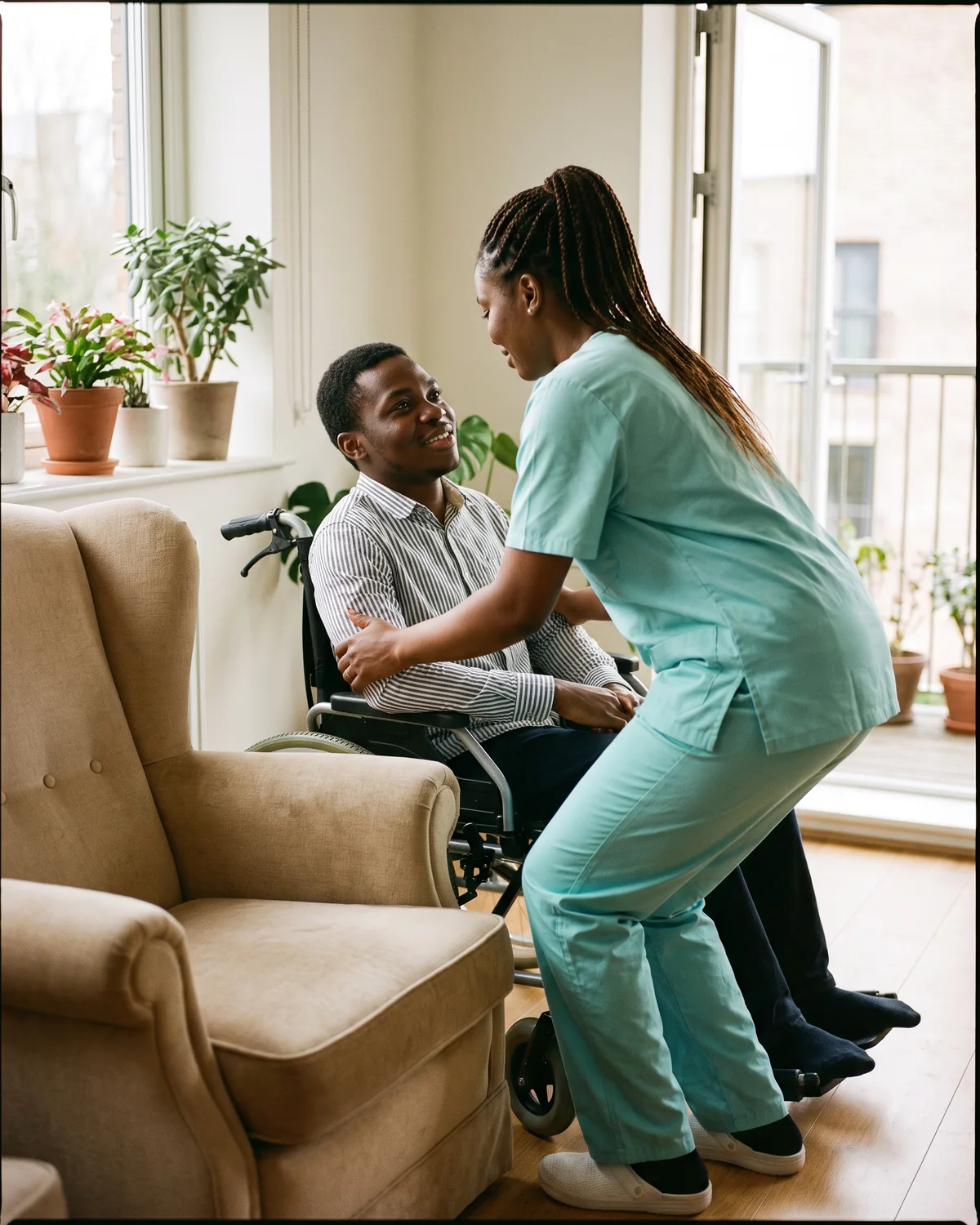 A caregiver performs a safe transfer with correct technique, mutual trust visible in both faces.